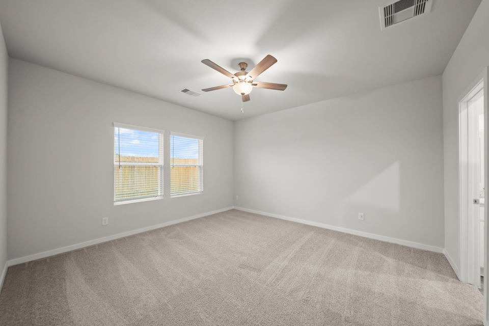 A room with a ceiling fan and a ceiling fan.
