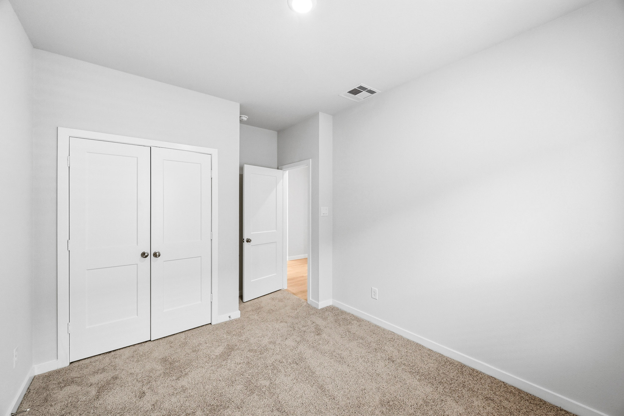 A room with white doors.