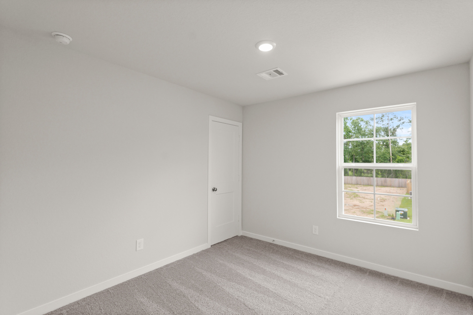 A room with a door and a window.
