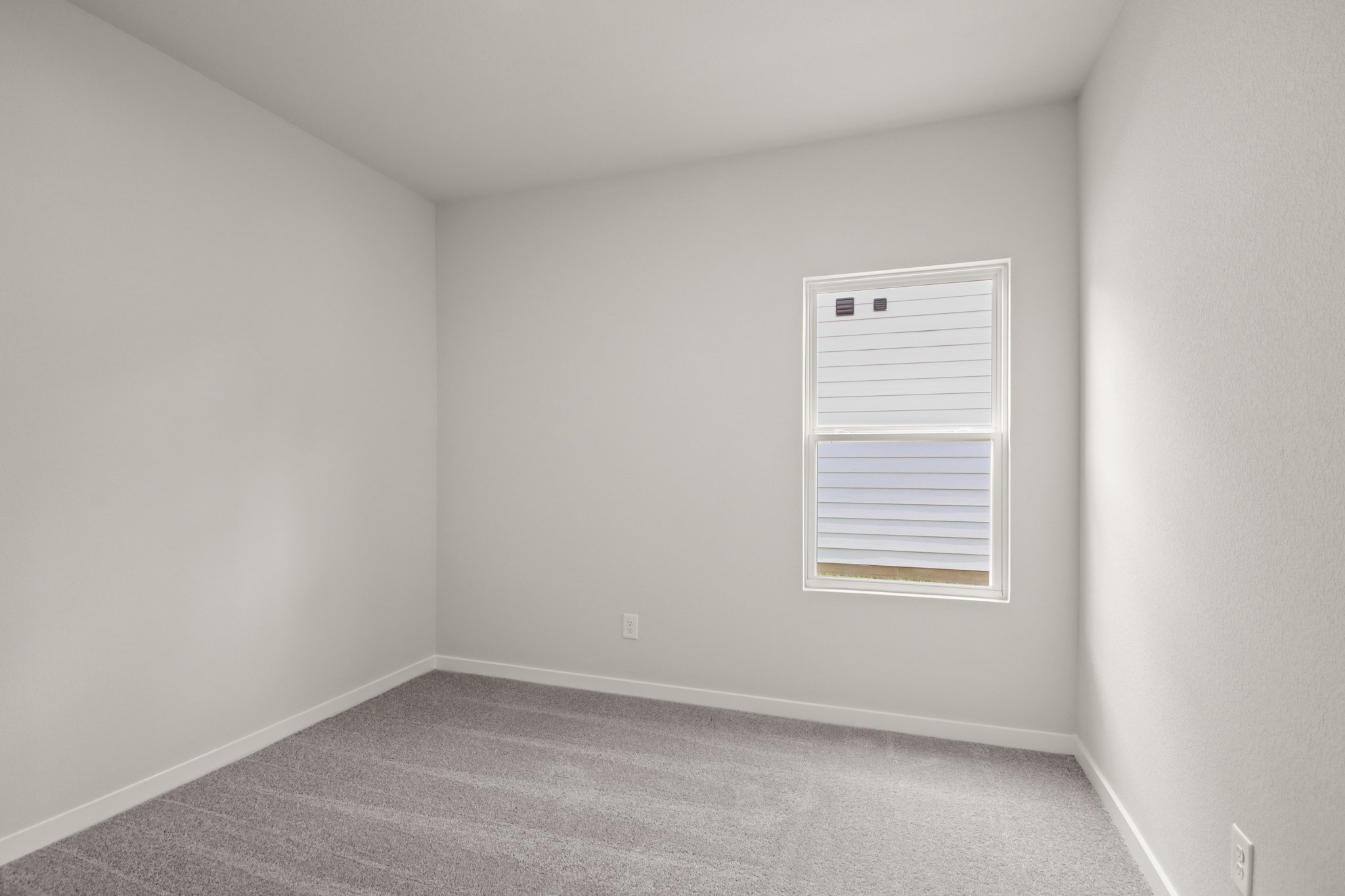 A room with a door and a window.