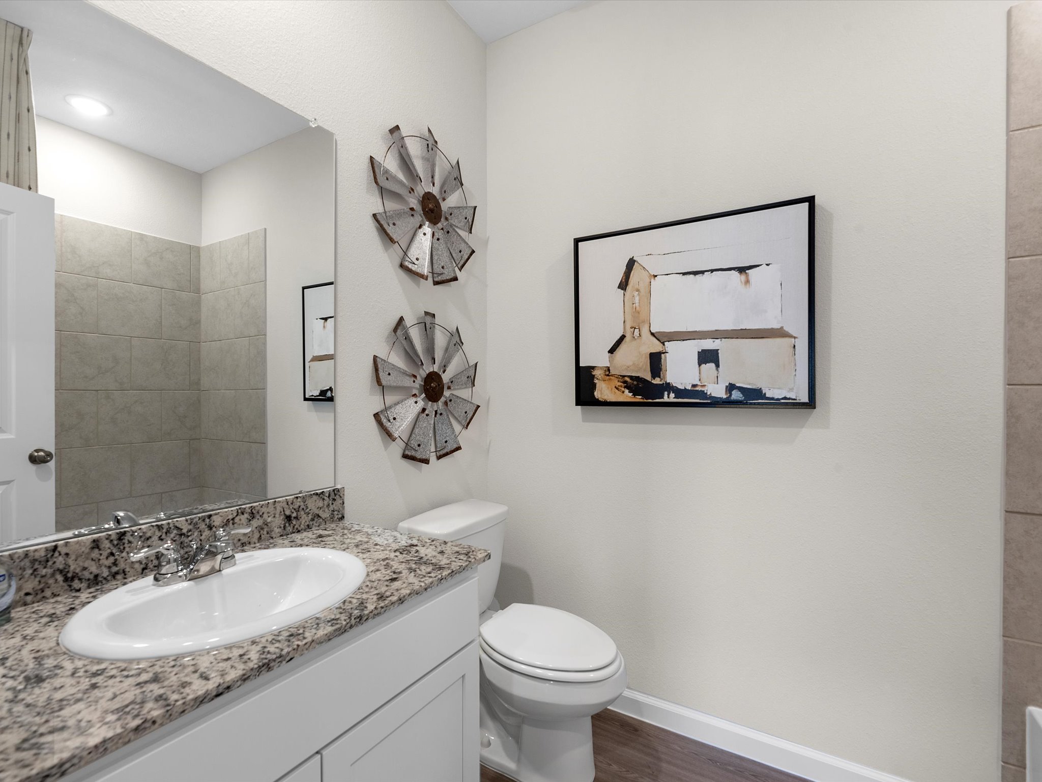 A bathroom with a mirror and sink.