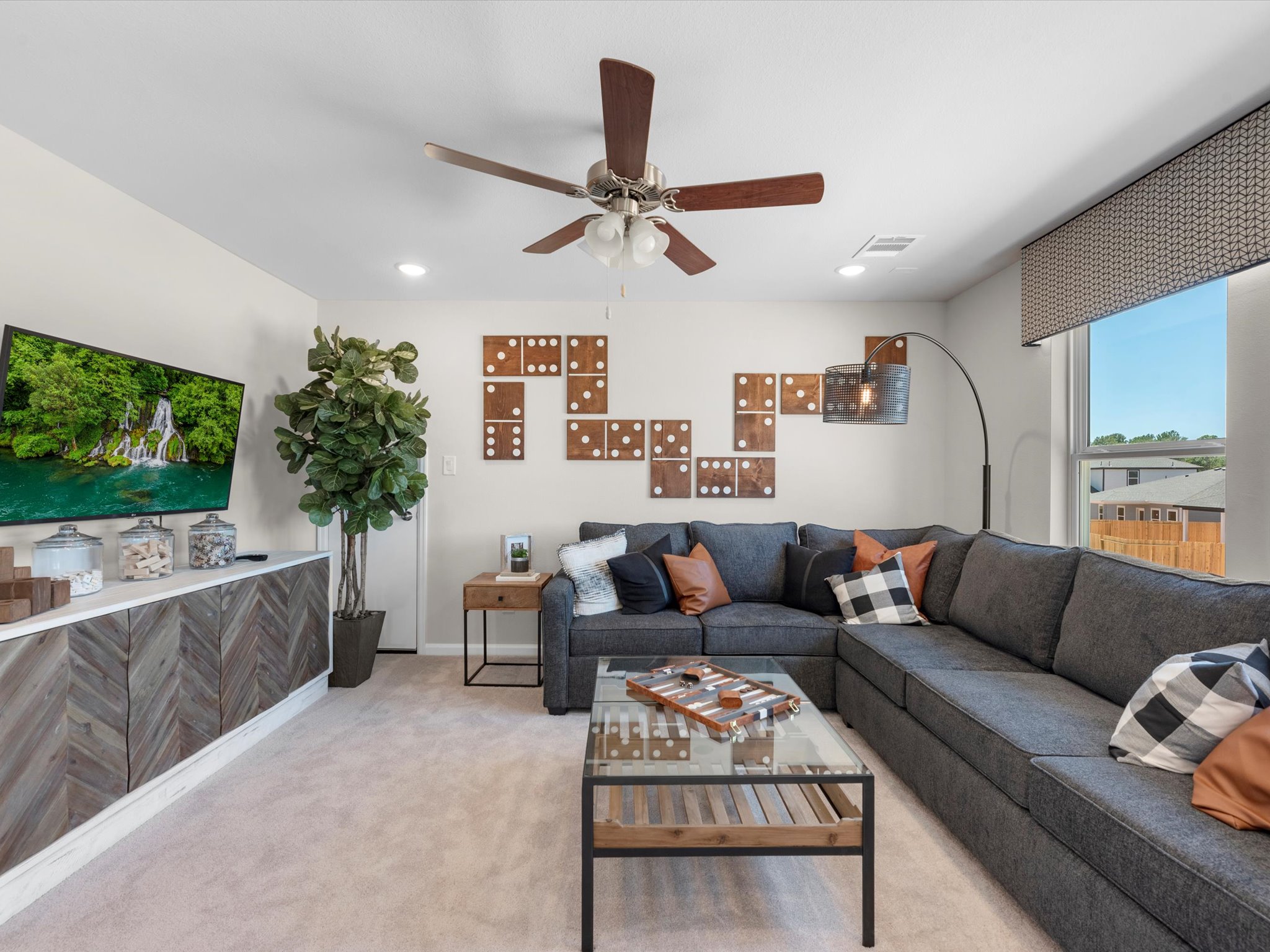 A living room with a couch and a table.