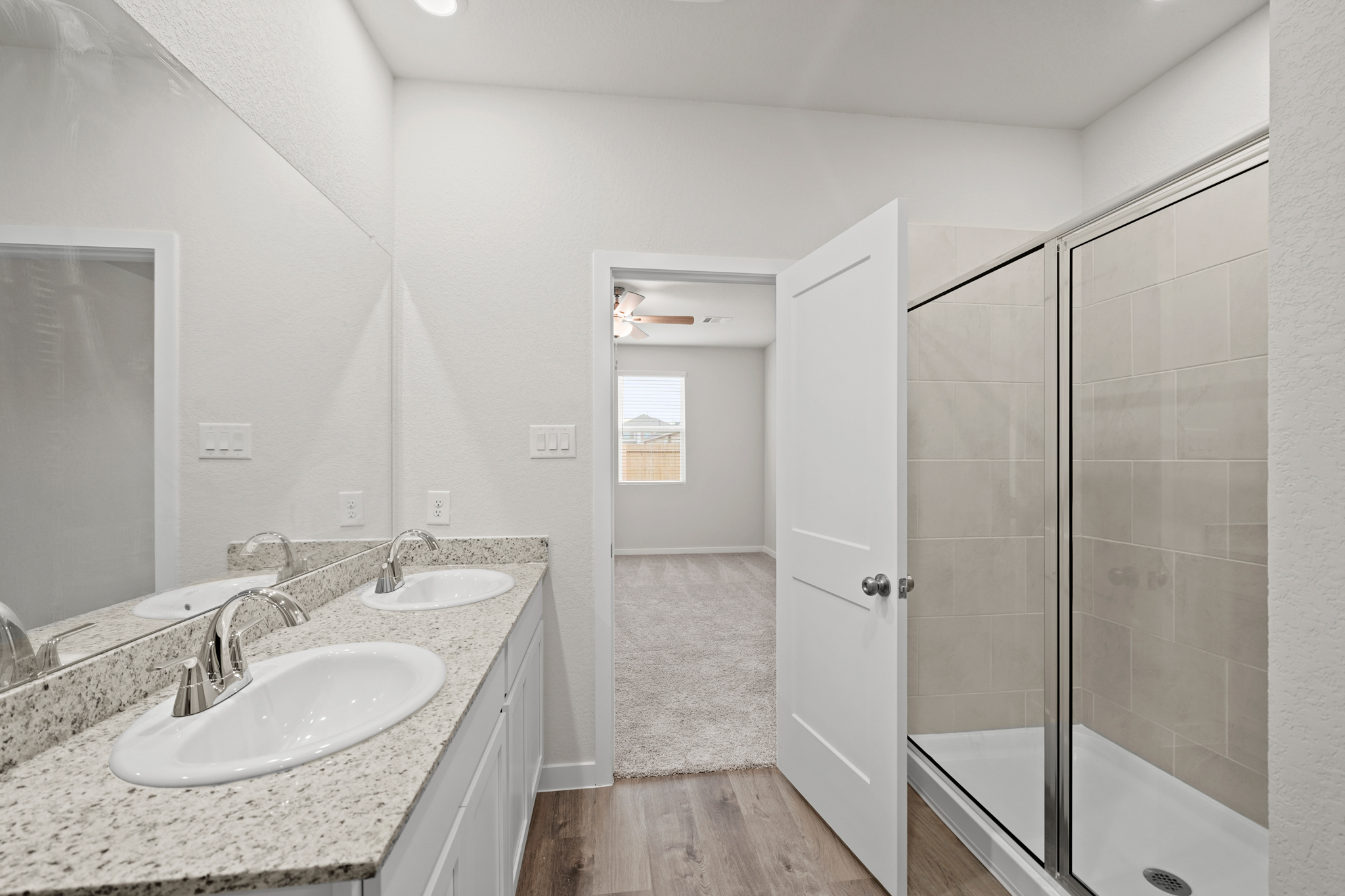 A bathroom with a glass shower.