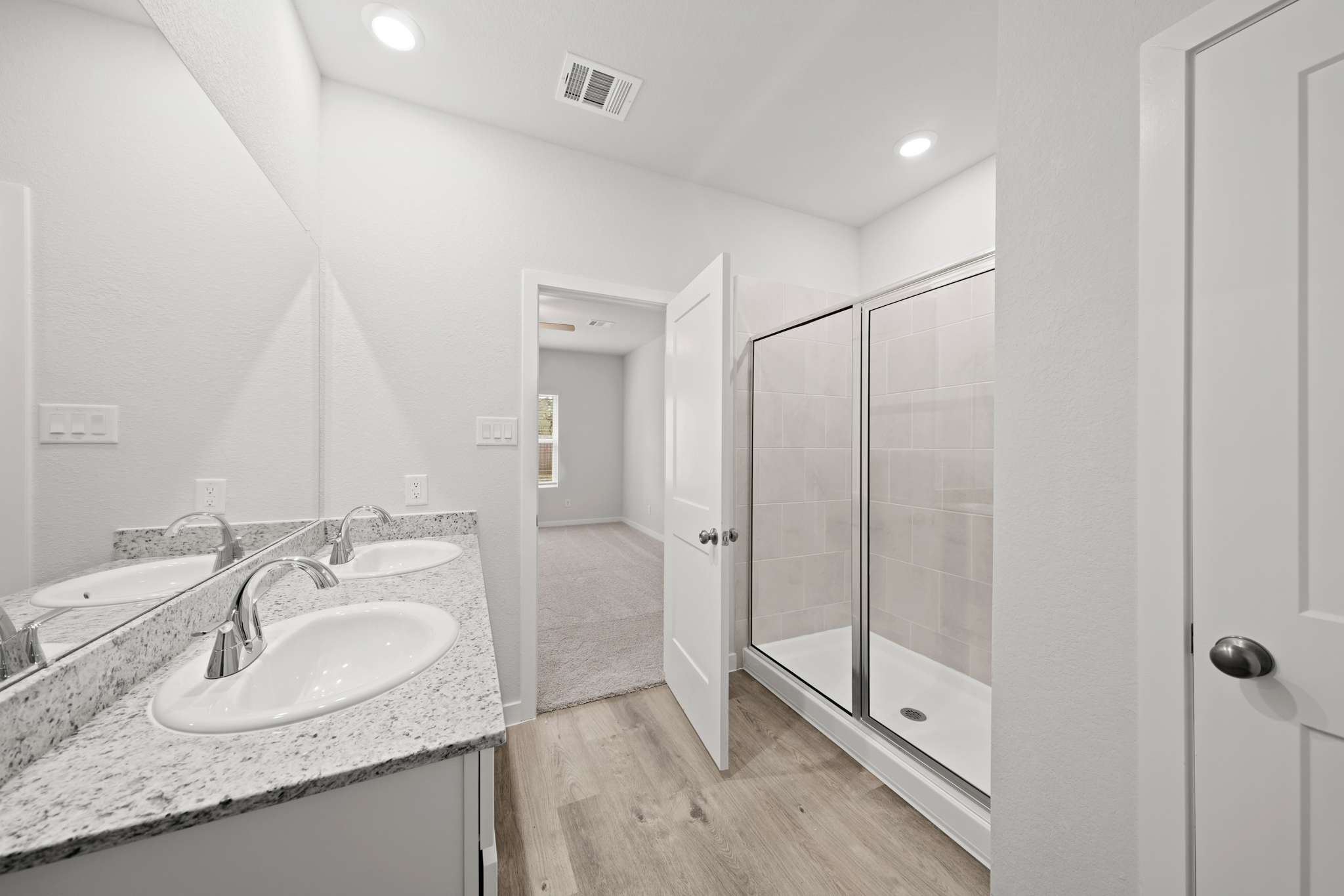 A bathroom with a glass shower.