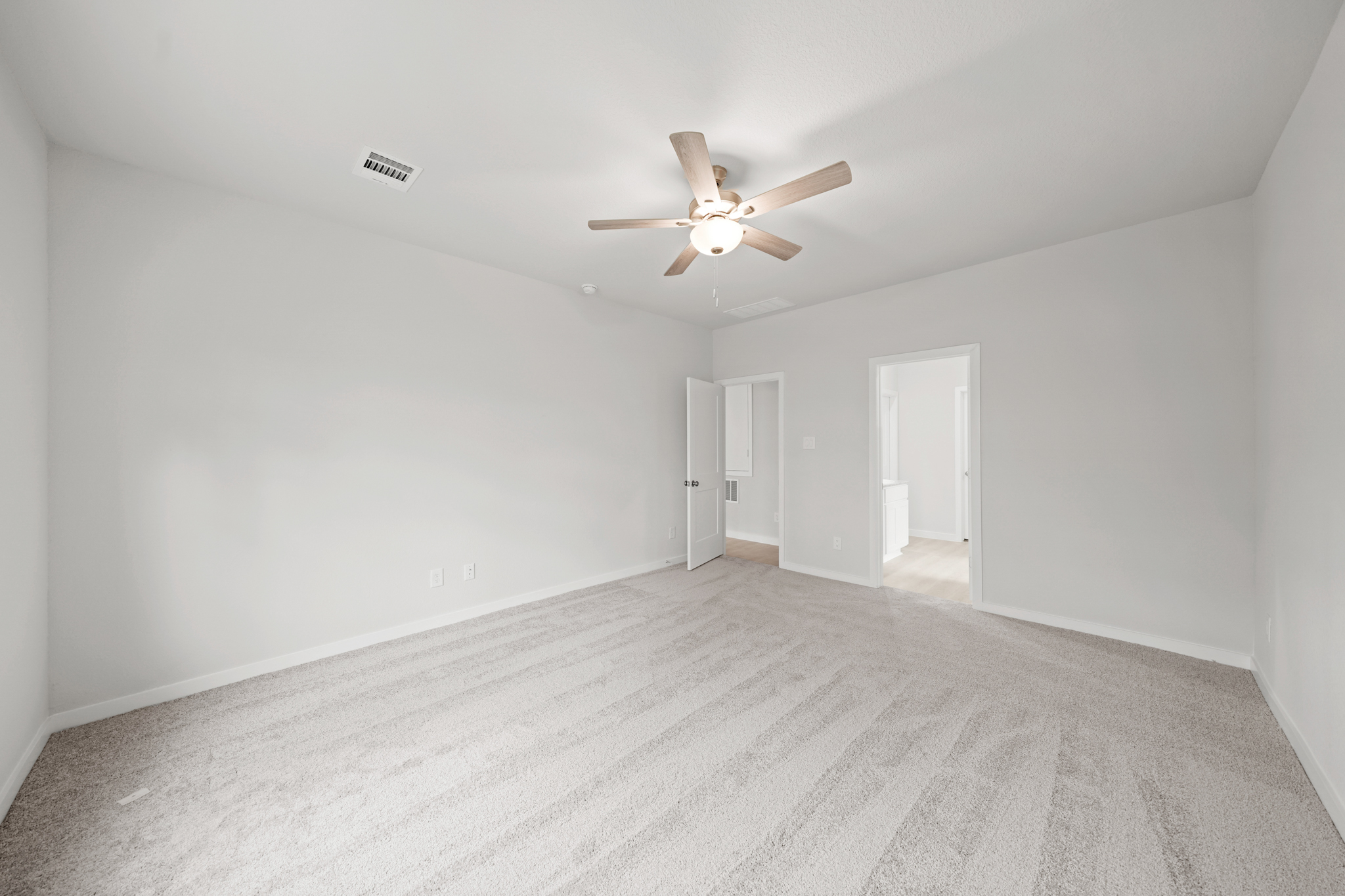 A room with a ceiling fan and a ceiling fan.