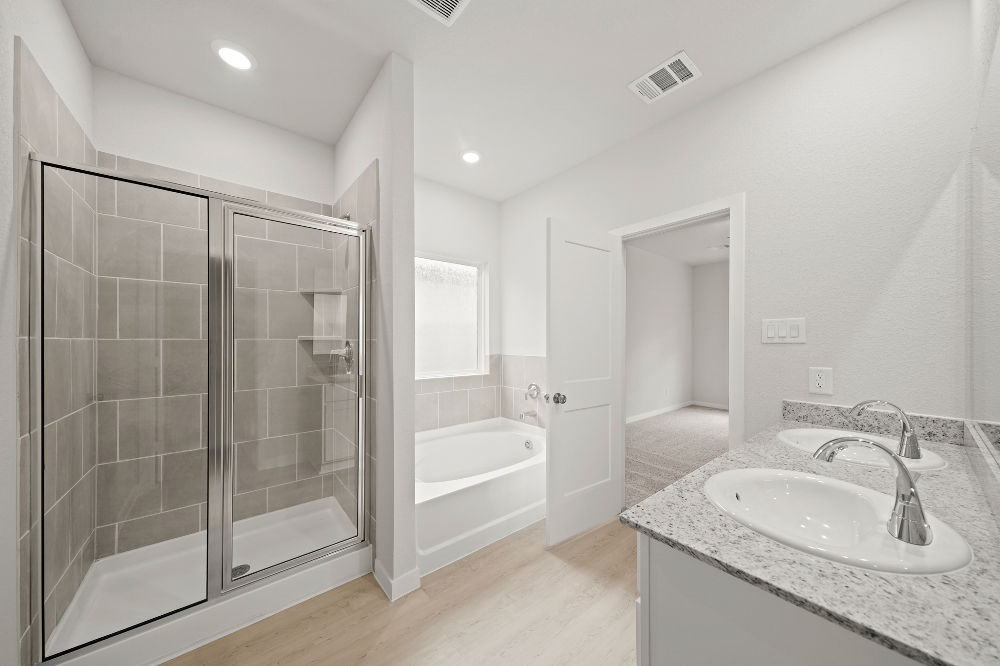 A bathroom with a glass shower.