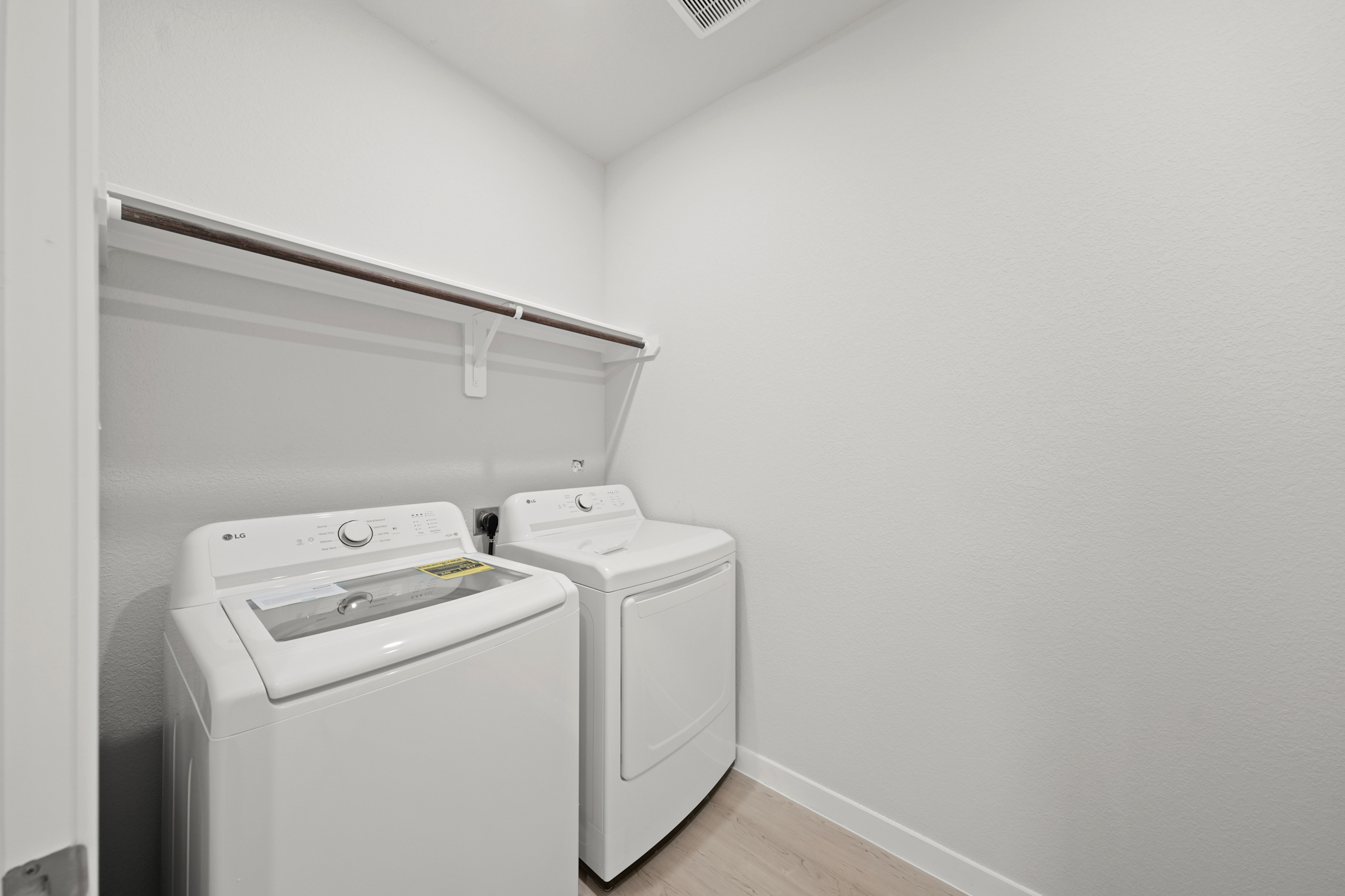 A washing machine in a room.