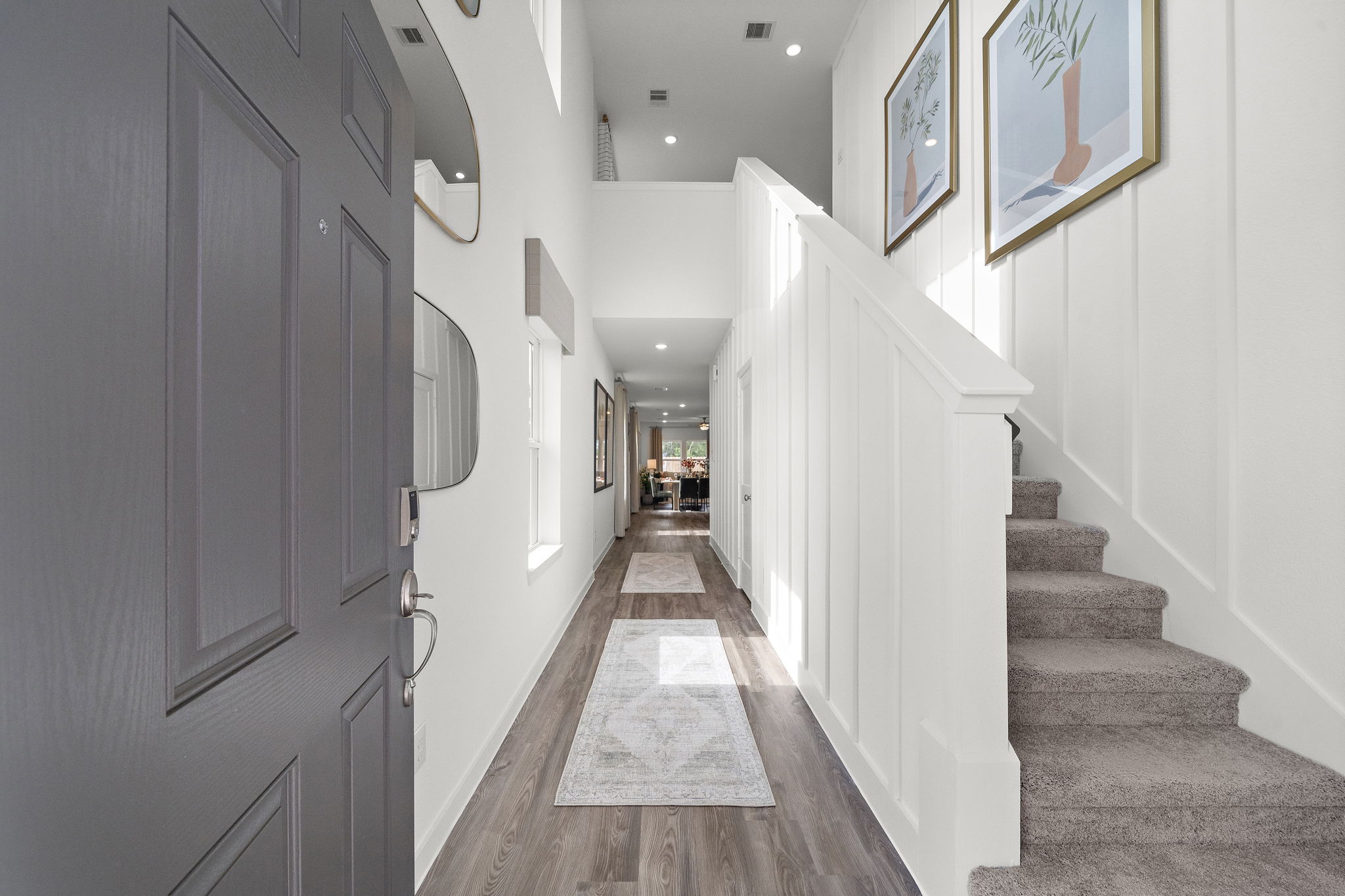 A hallway with white walls.