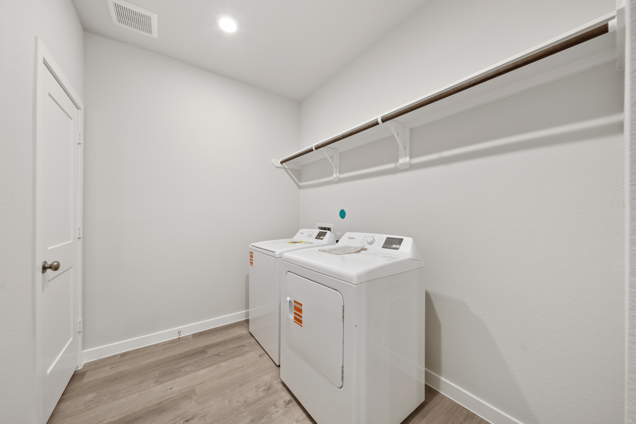 A white room with a white wall and a white cabinet.