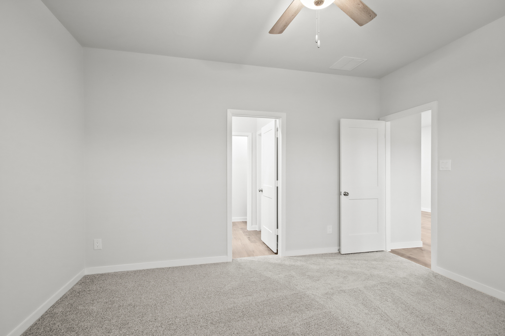 A room with white doors.