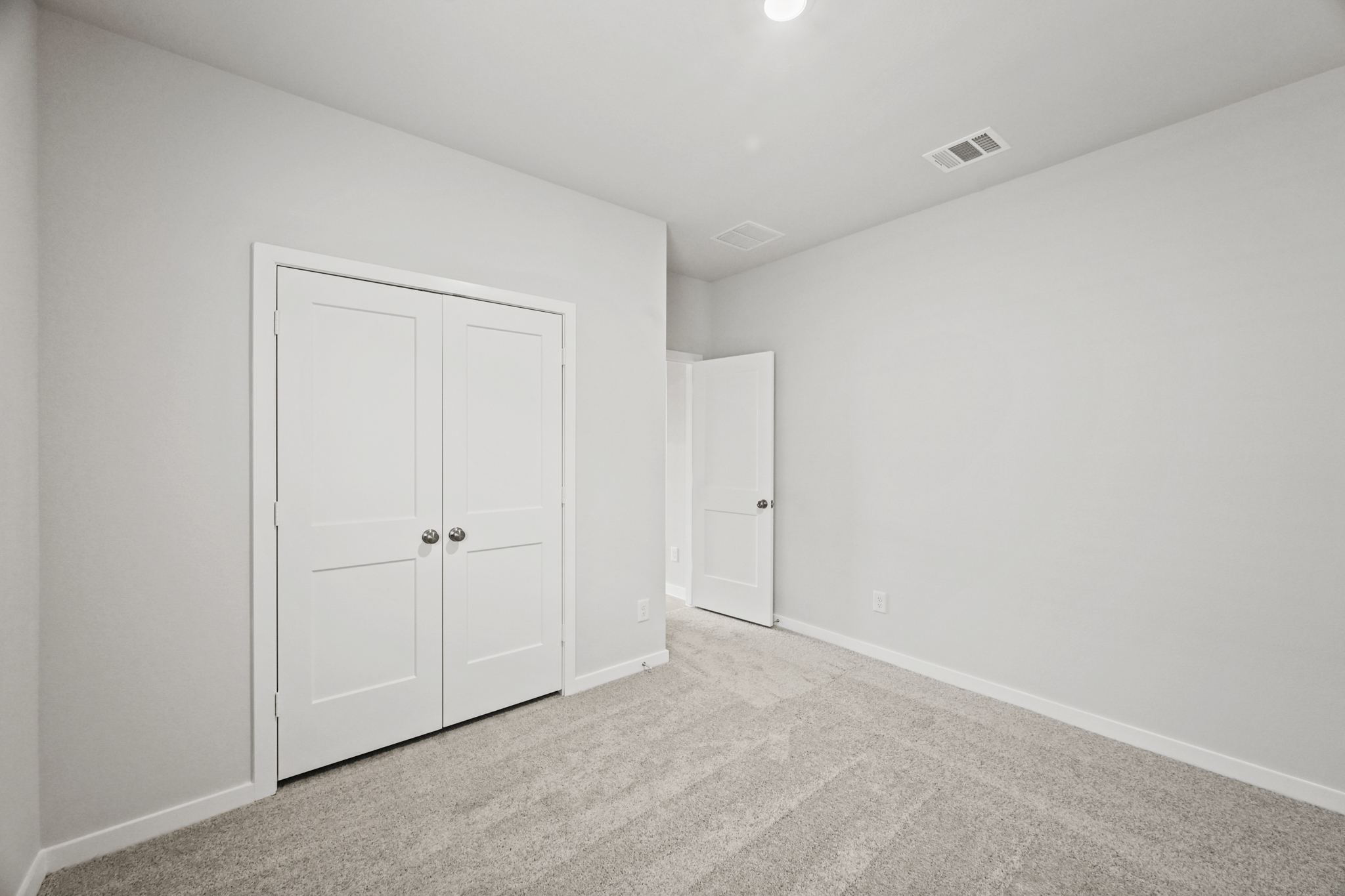 A room with white doors.