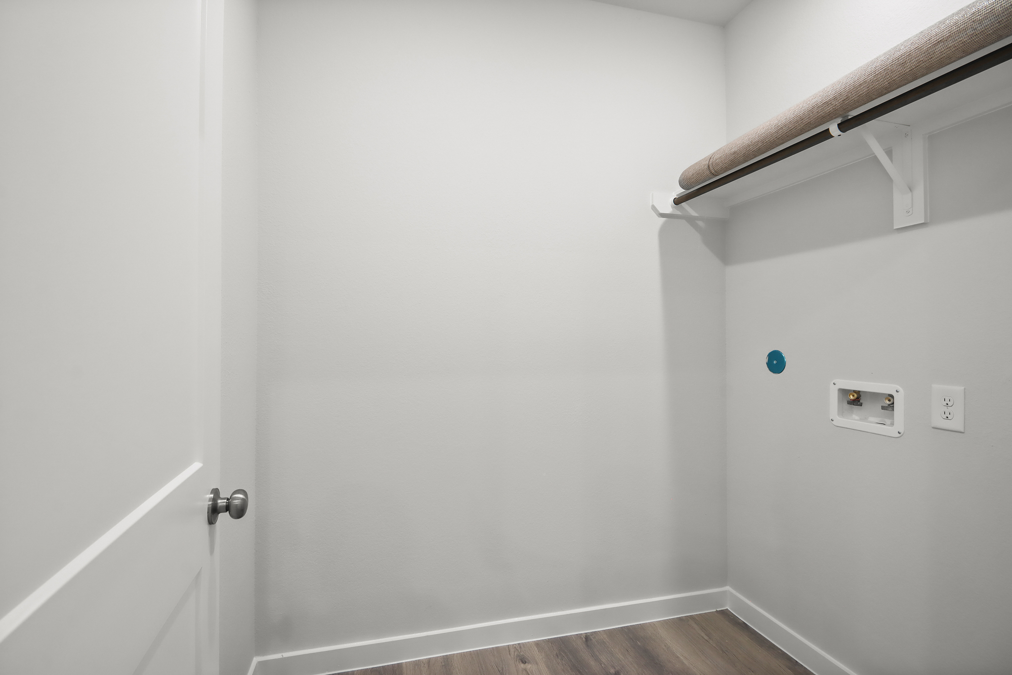 A white door with a light above it.