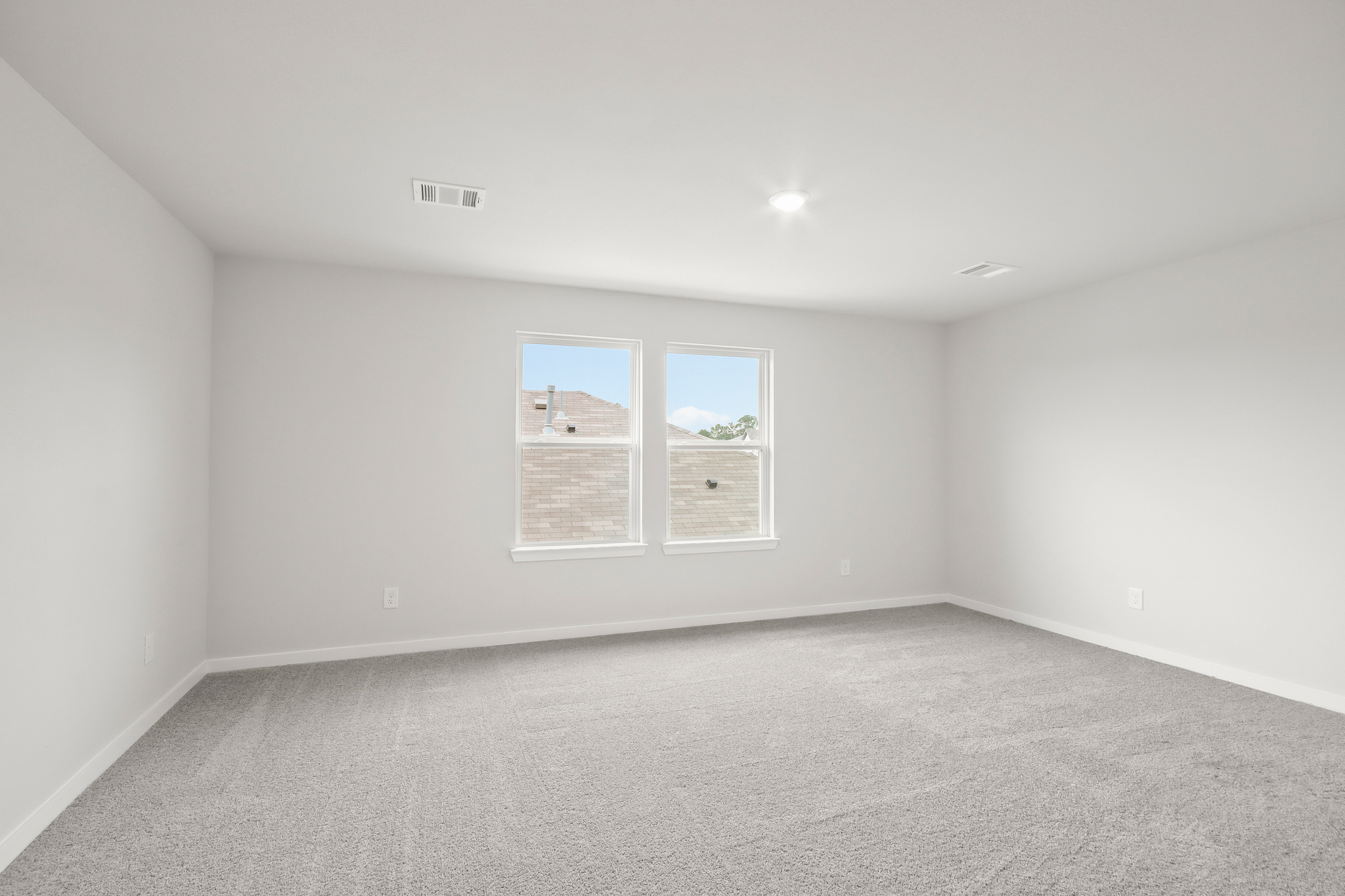 A room with a few windows.
