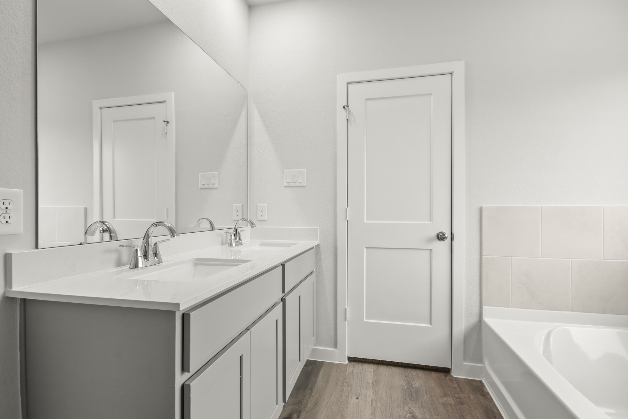 A bathroom with a sink and a bathtub.