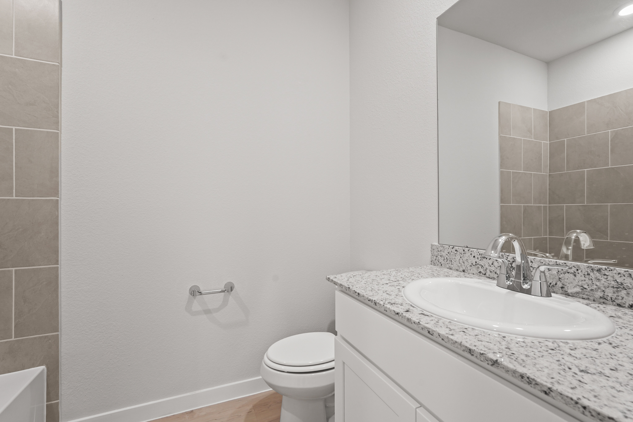 A bathroom with a sink and a toilet.