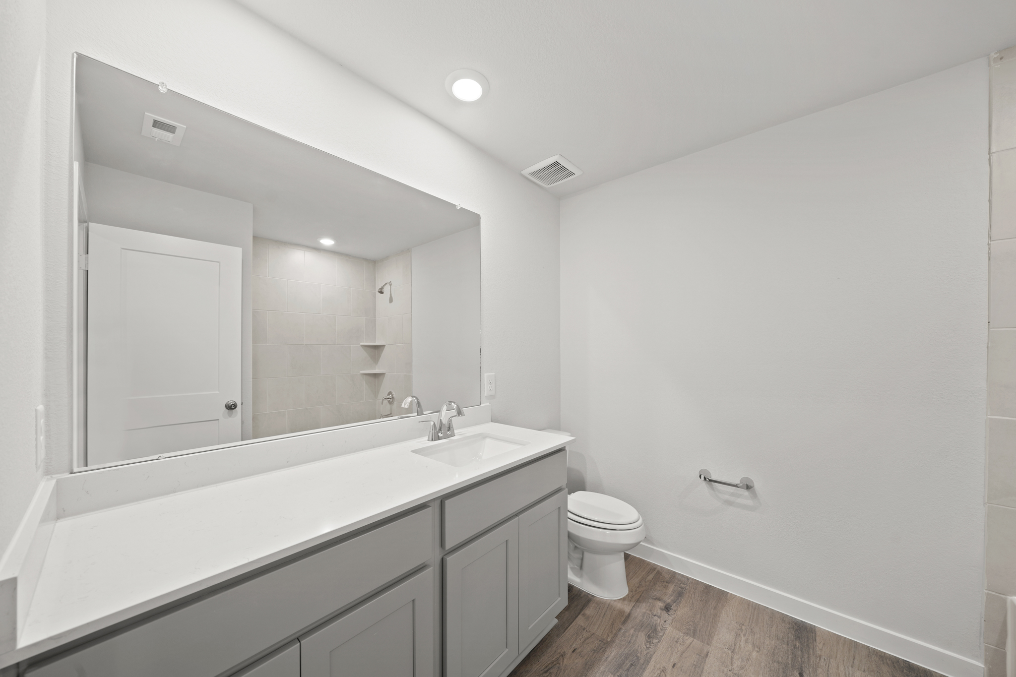 A bathroom with a toilet and sink.