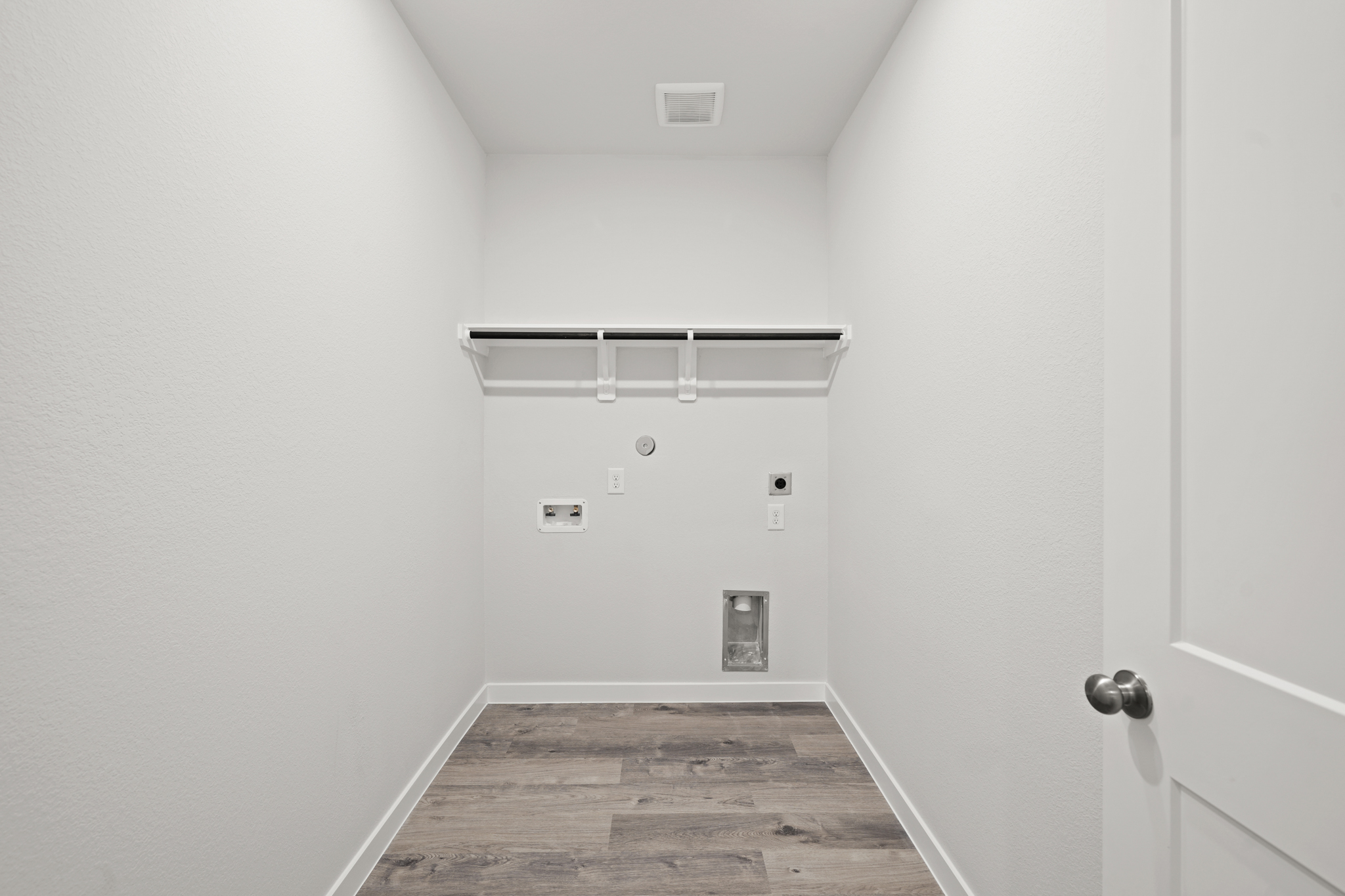 A hallway with white doors.