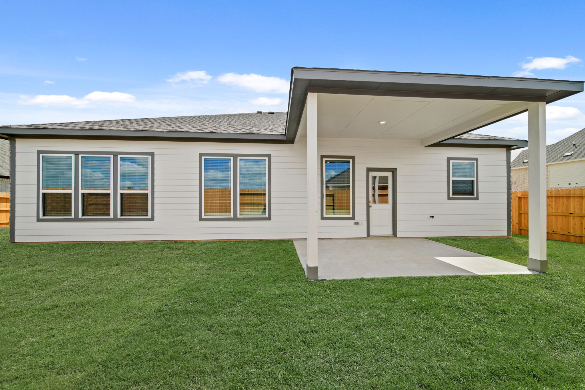 A house with a grass yard.