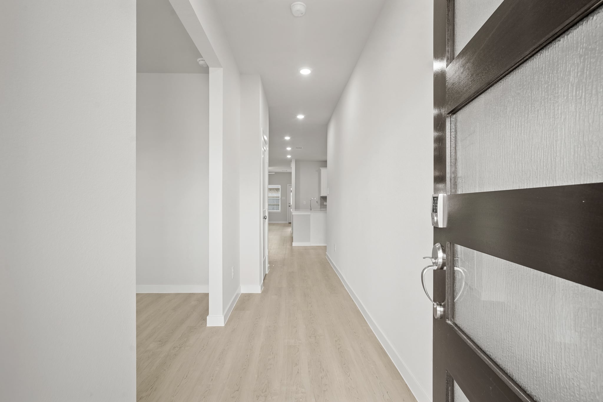 A hallway with white walls.