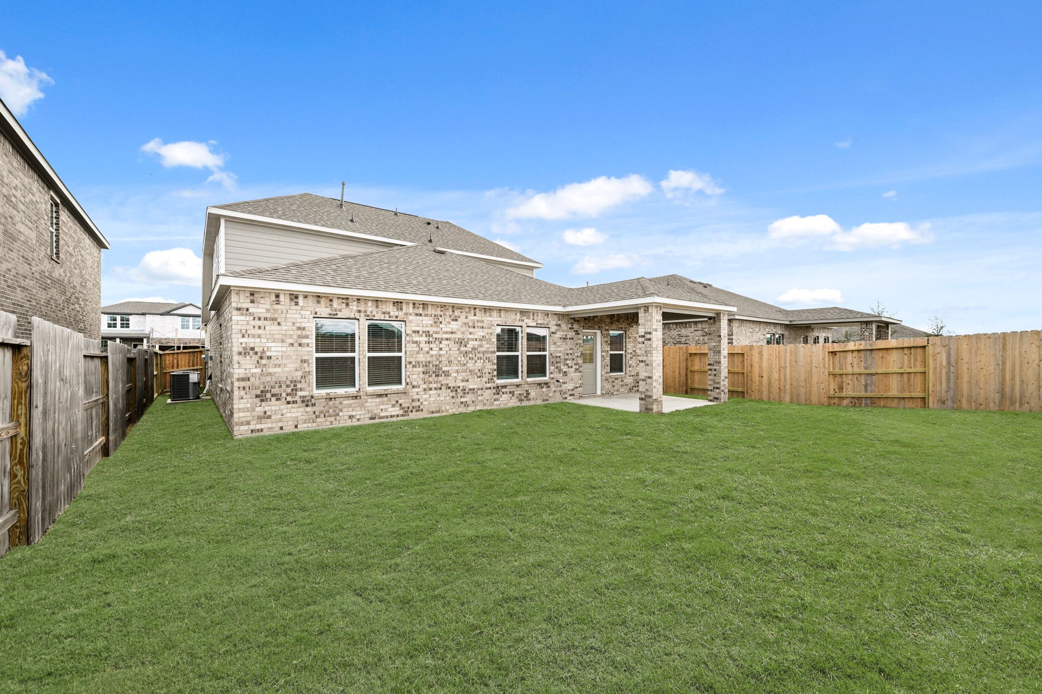 A large house with a fence around it.