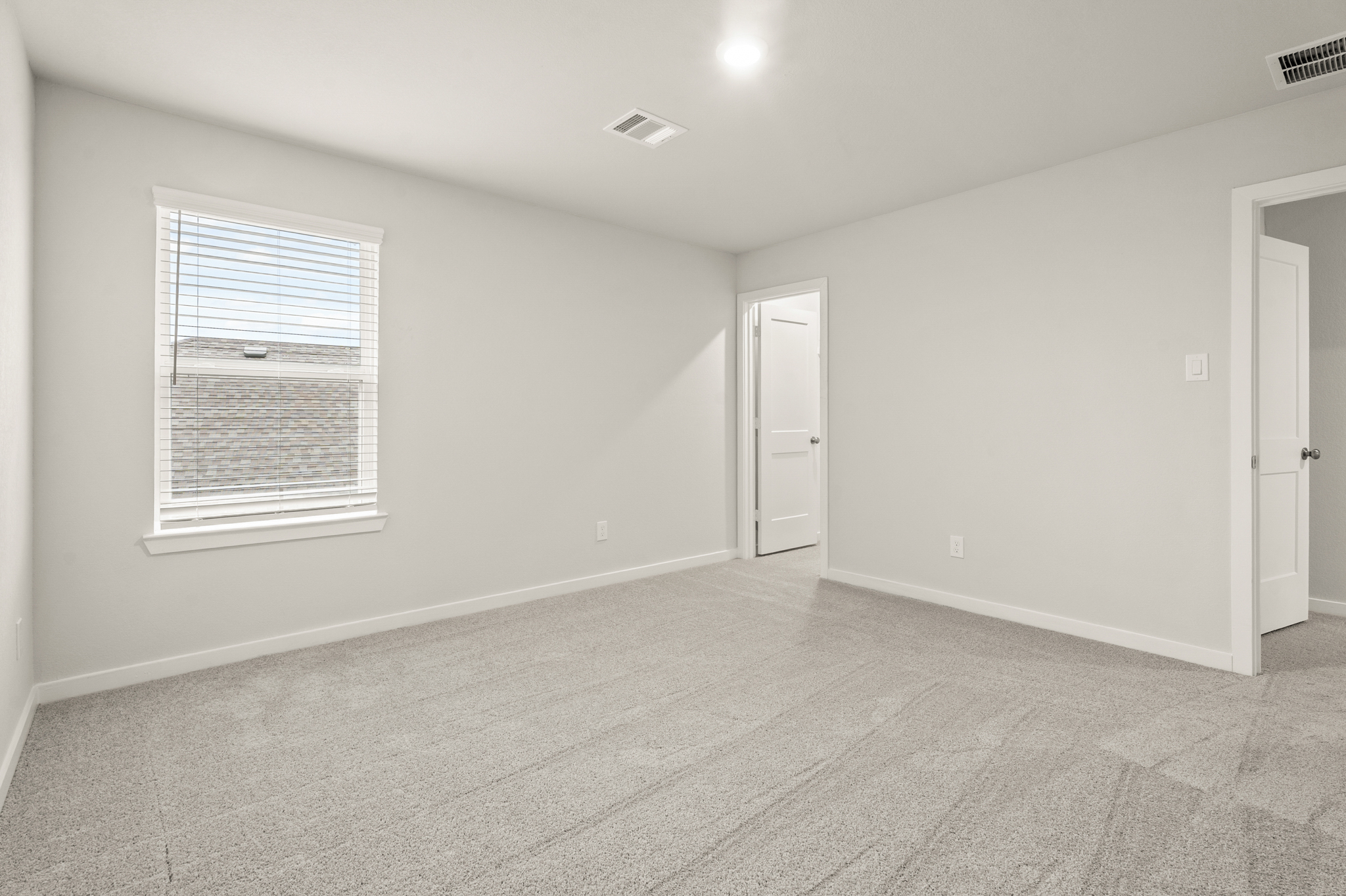 A room with a door and a window.