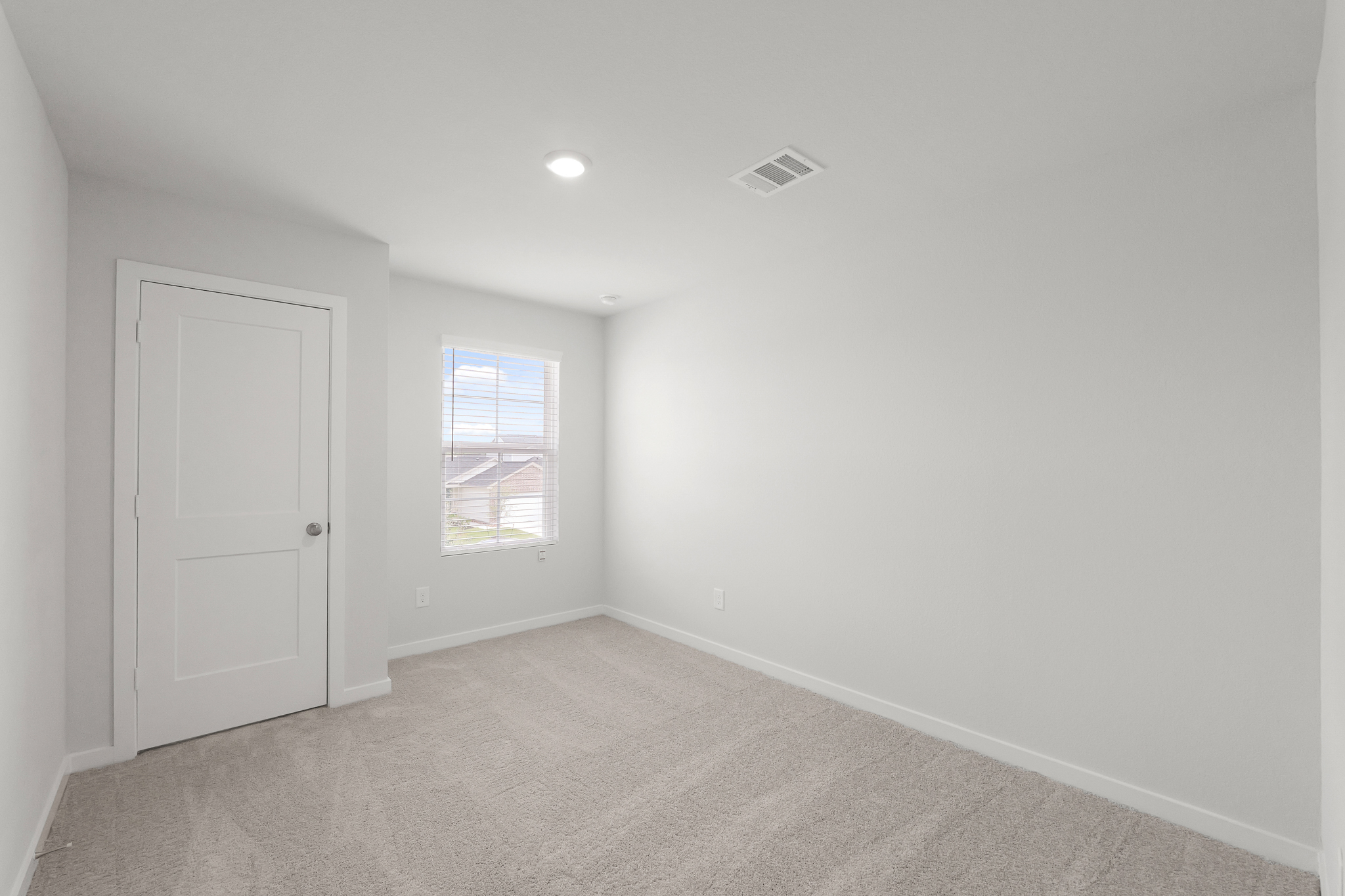 A room with a door and a window.