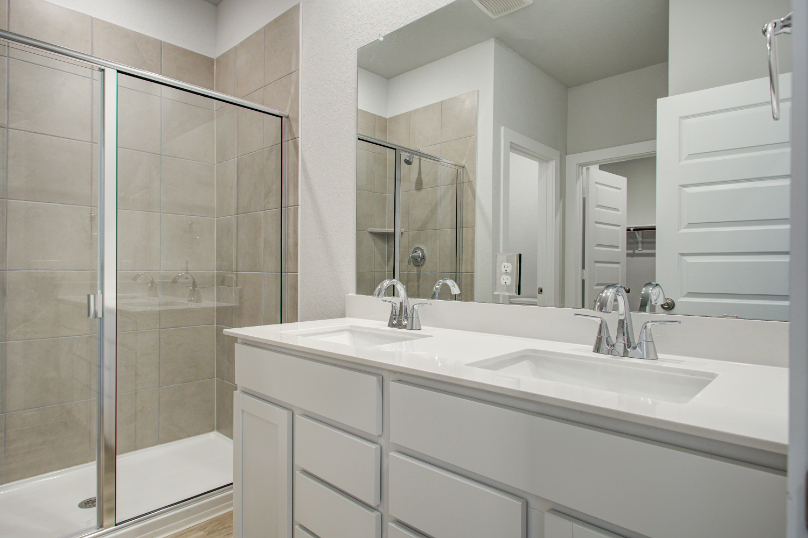 A bathroom with a glass shower.
