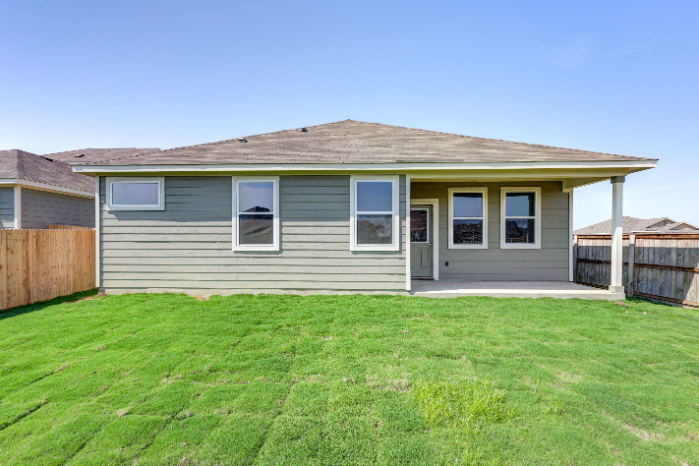 A house with a grass yard.