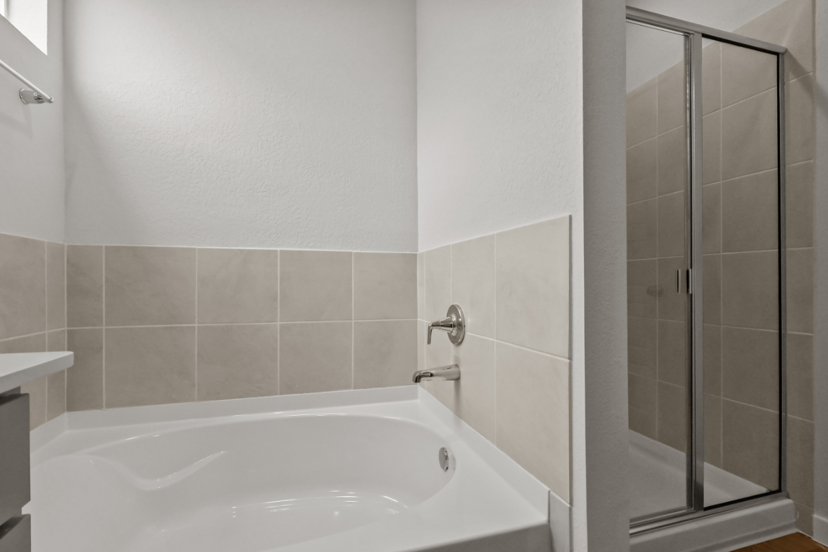 A bathroom with a glass shower.