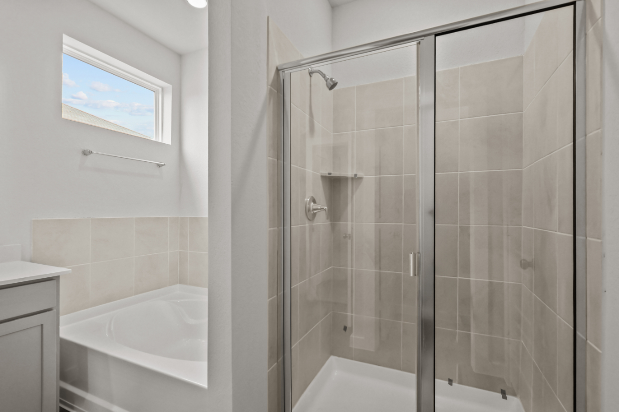 A bathroom with a glass shower.