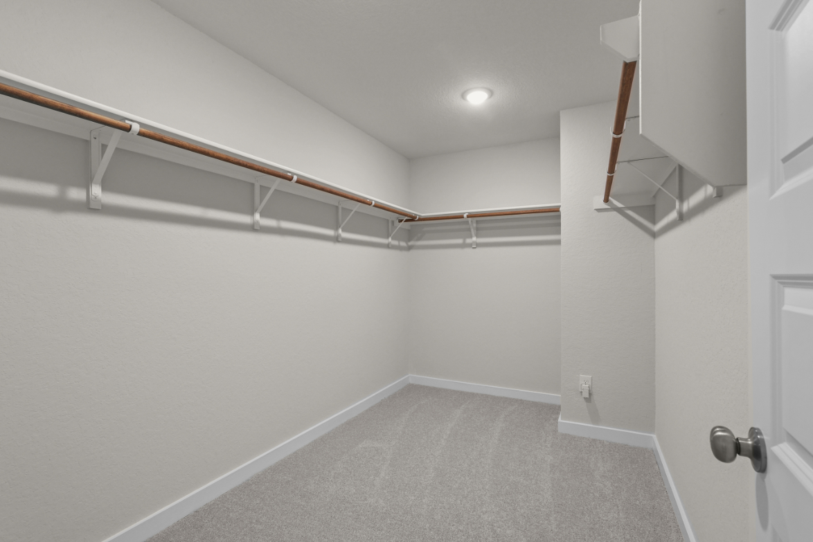 A hallway with white walls.