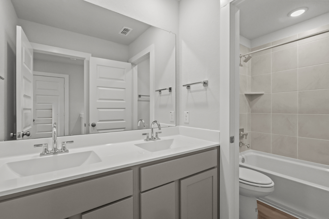 A bathroom with a sink and a toilet.