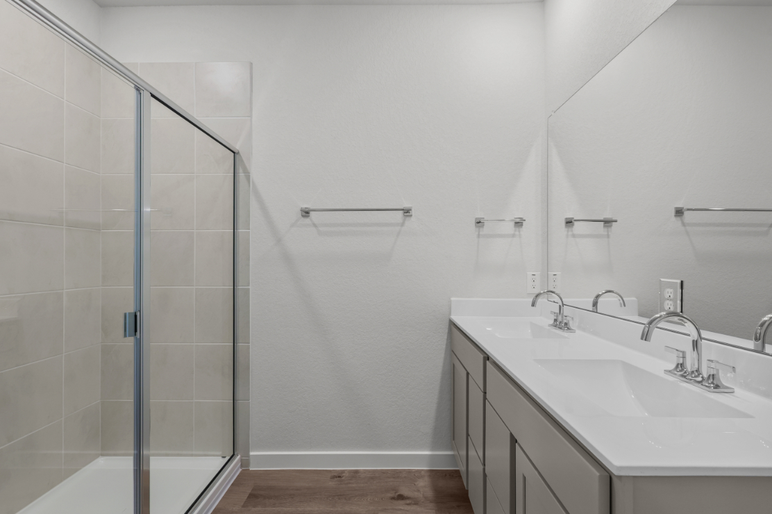 A bathroom with a glass shower.