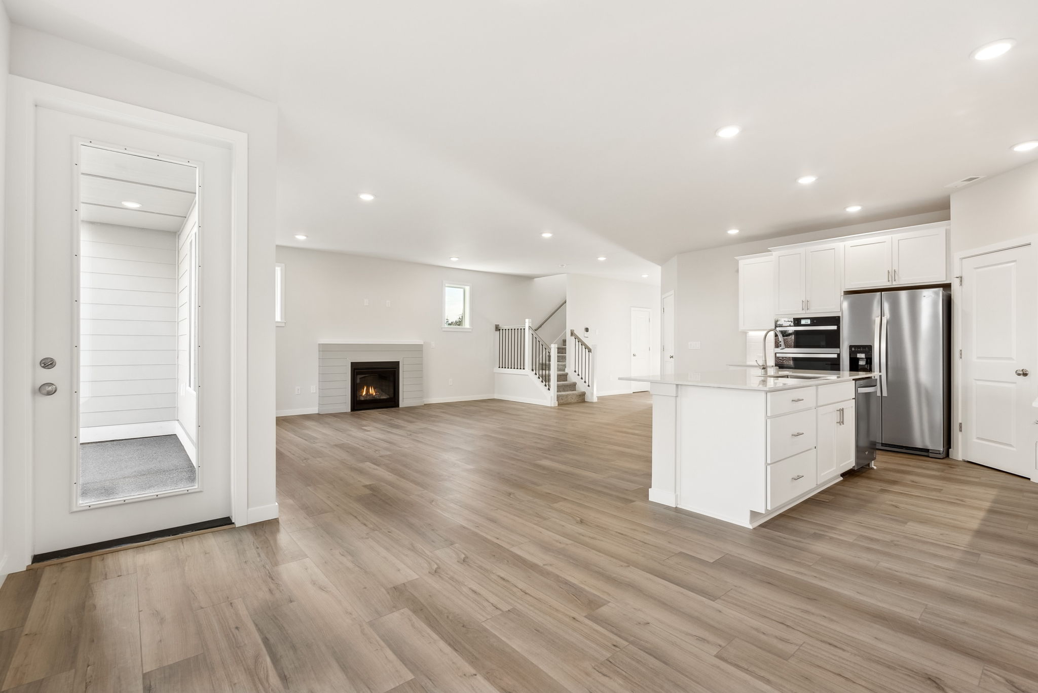 A large kitchen with white cabinets.