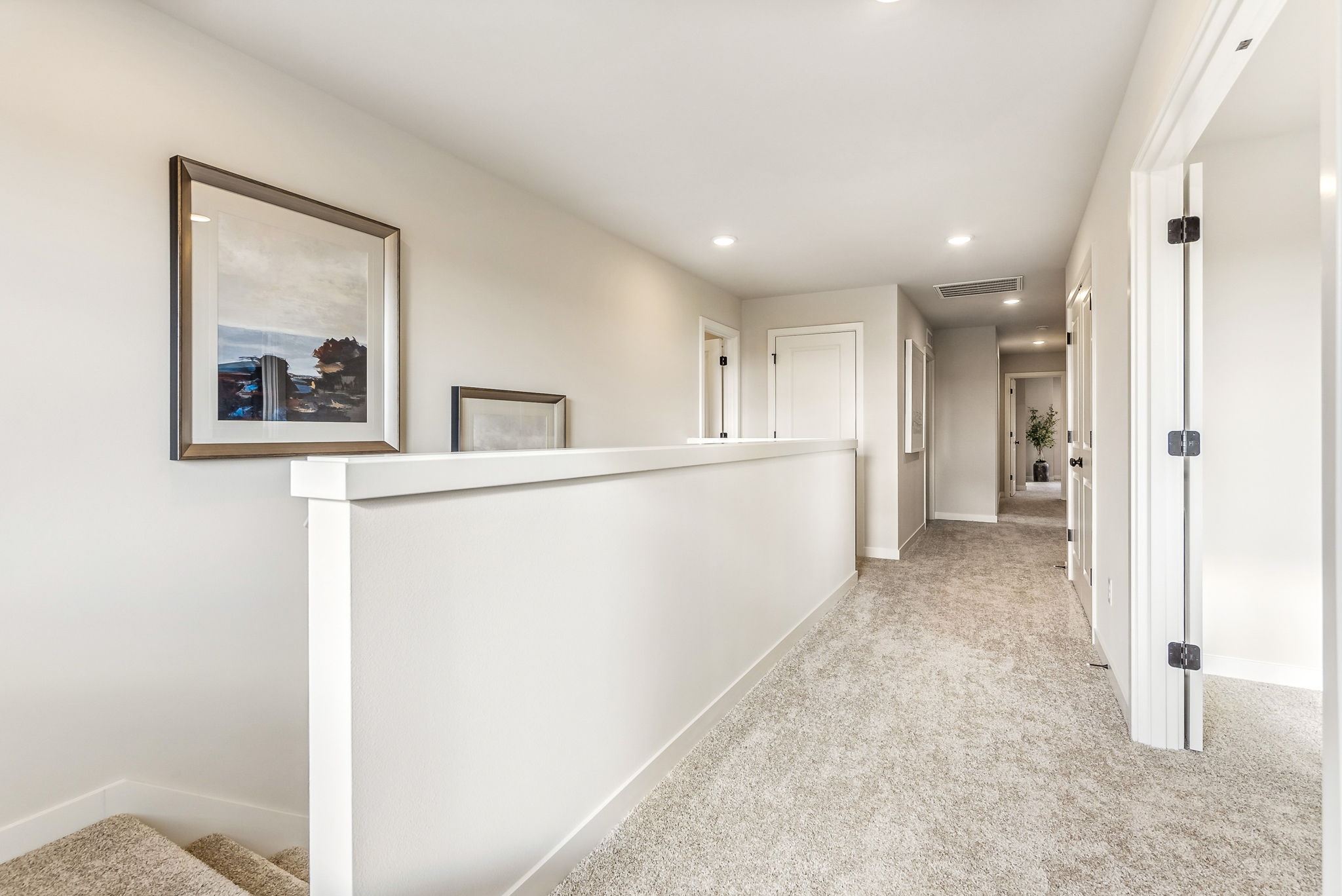A long hallway with white walls.