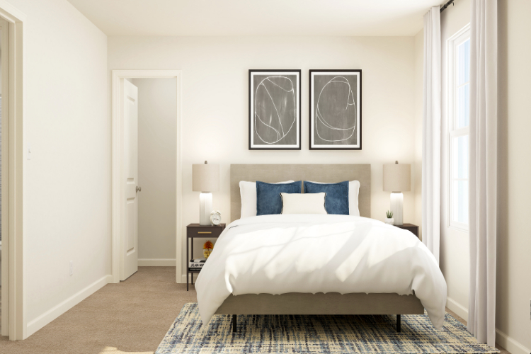 A bedroom with a bed and lamps.