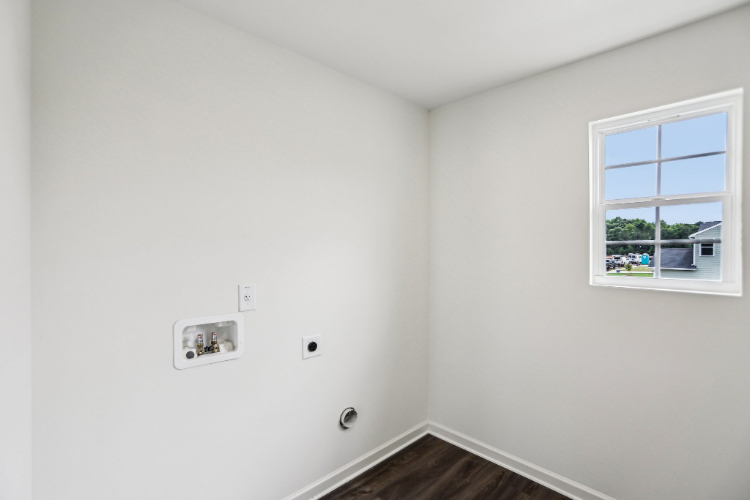 A white wall with a window.