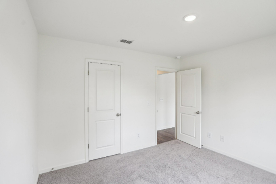 A room with white doors.