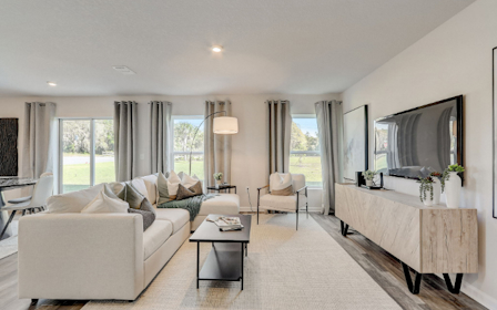 A living room with a large mirror.