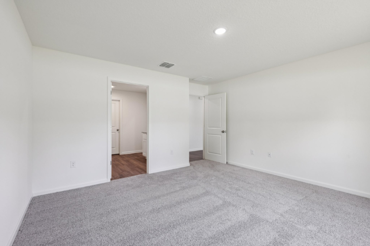 A hallway with white walls.