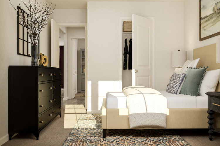 A room with a bed and a dresser.