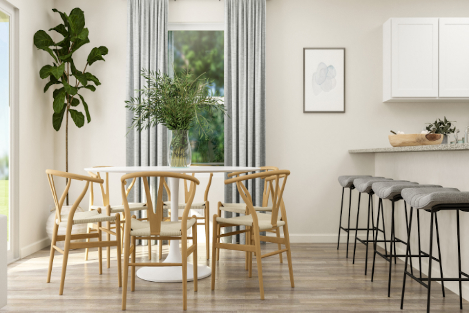 A dining room table with chairs.