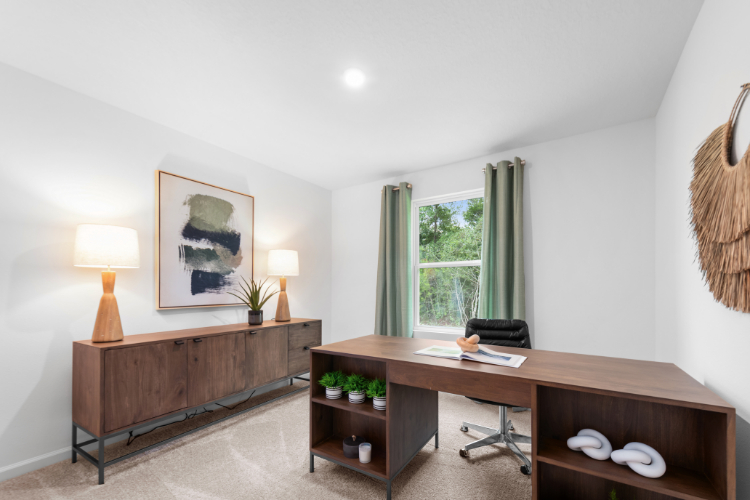 A room with a desk and lamp.