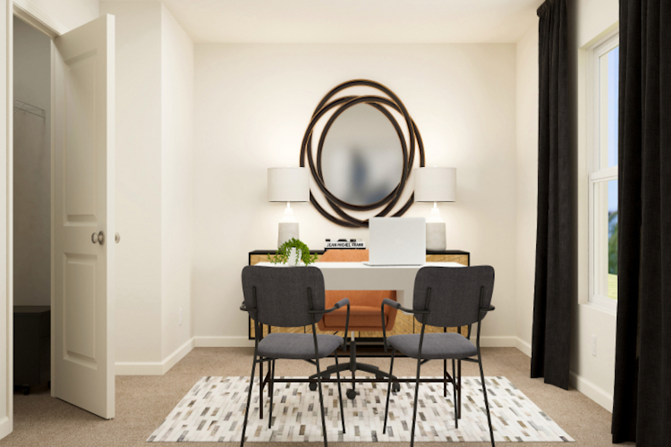 A dining room table with chairs.