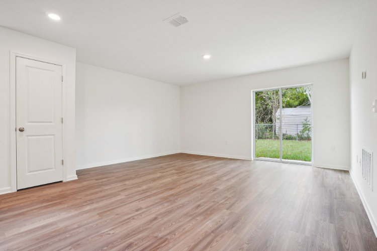 A room with a wood floor and a wood floor.