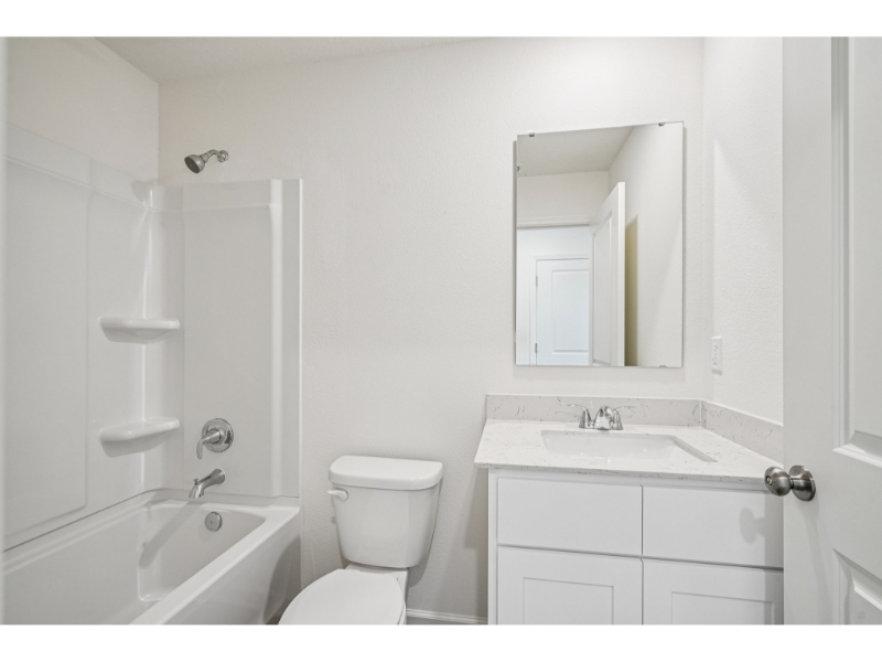 A bathroom with a toilet and sink.