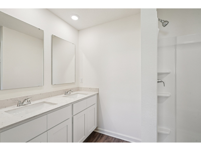 A bathroom with a sink and a toilet.