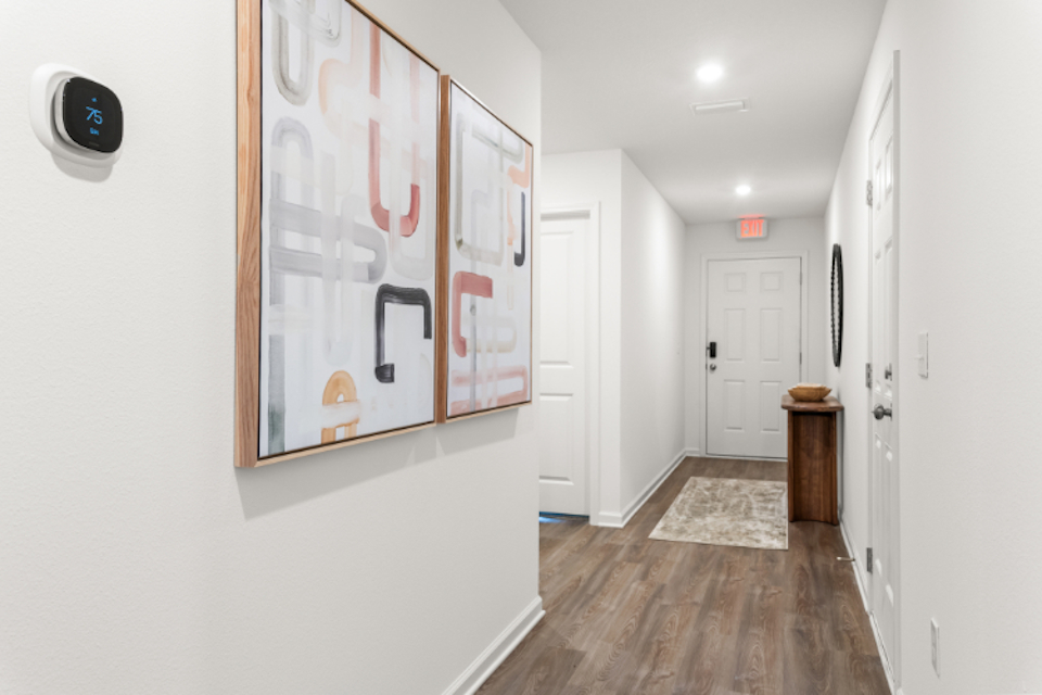 A hallway with white walls.