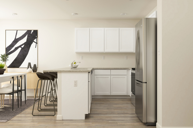 A kitchen with white cabinets.