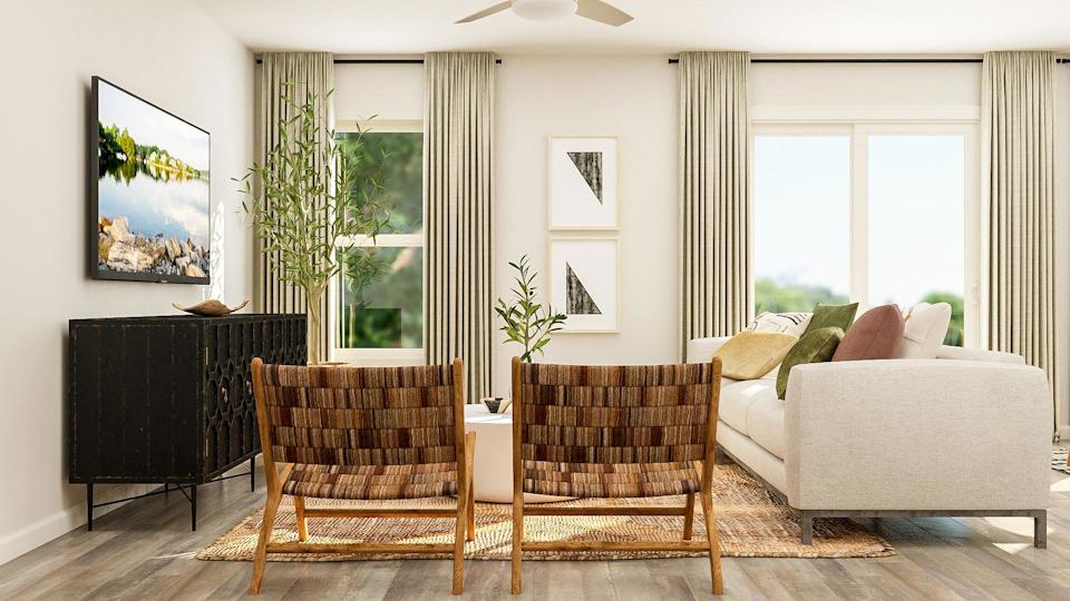 A living room with a couch and chairs.